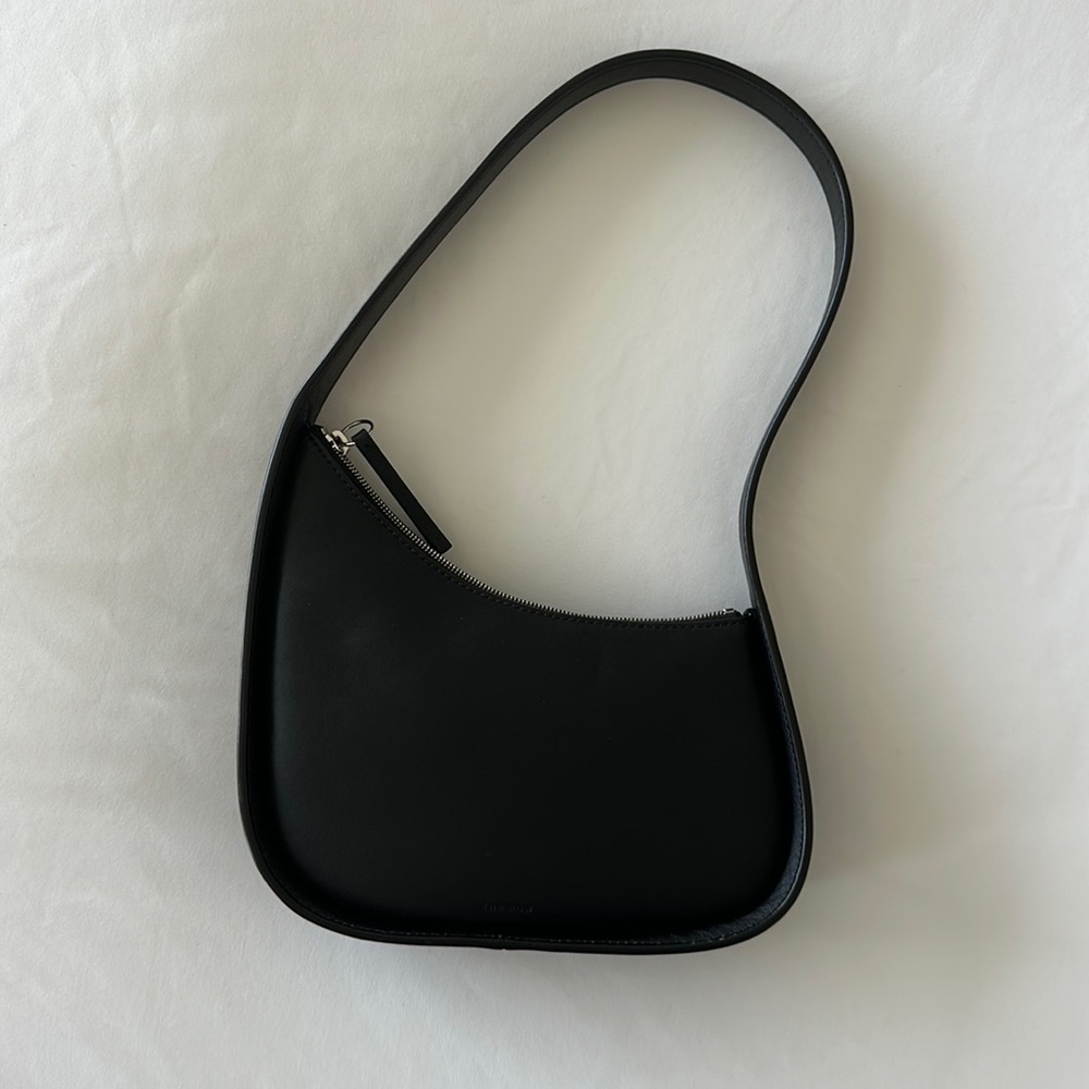 The row half moon bag